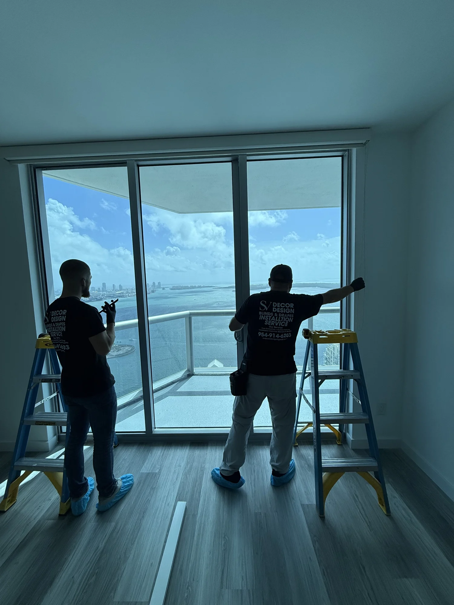S&V Decor Design installers at work overlooking a South Florida balcony