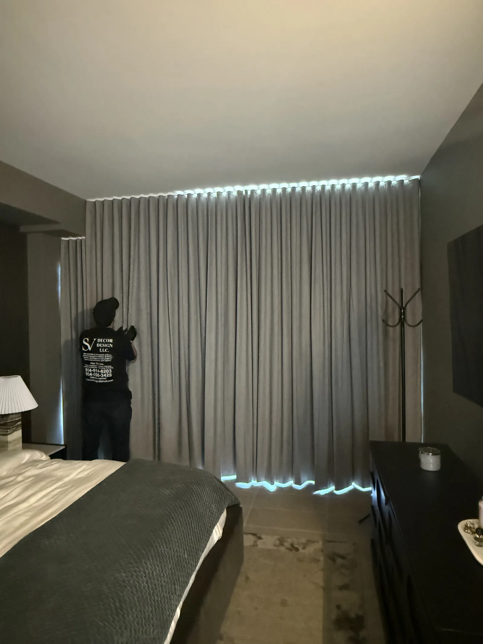 Blackout drapery with LED cove lighting in a bedroom