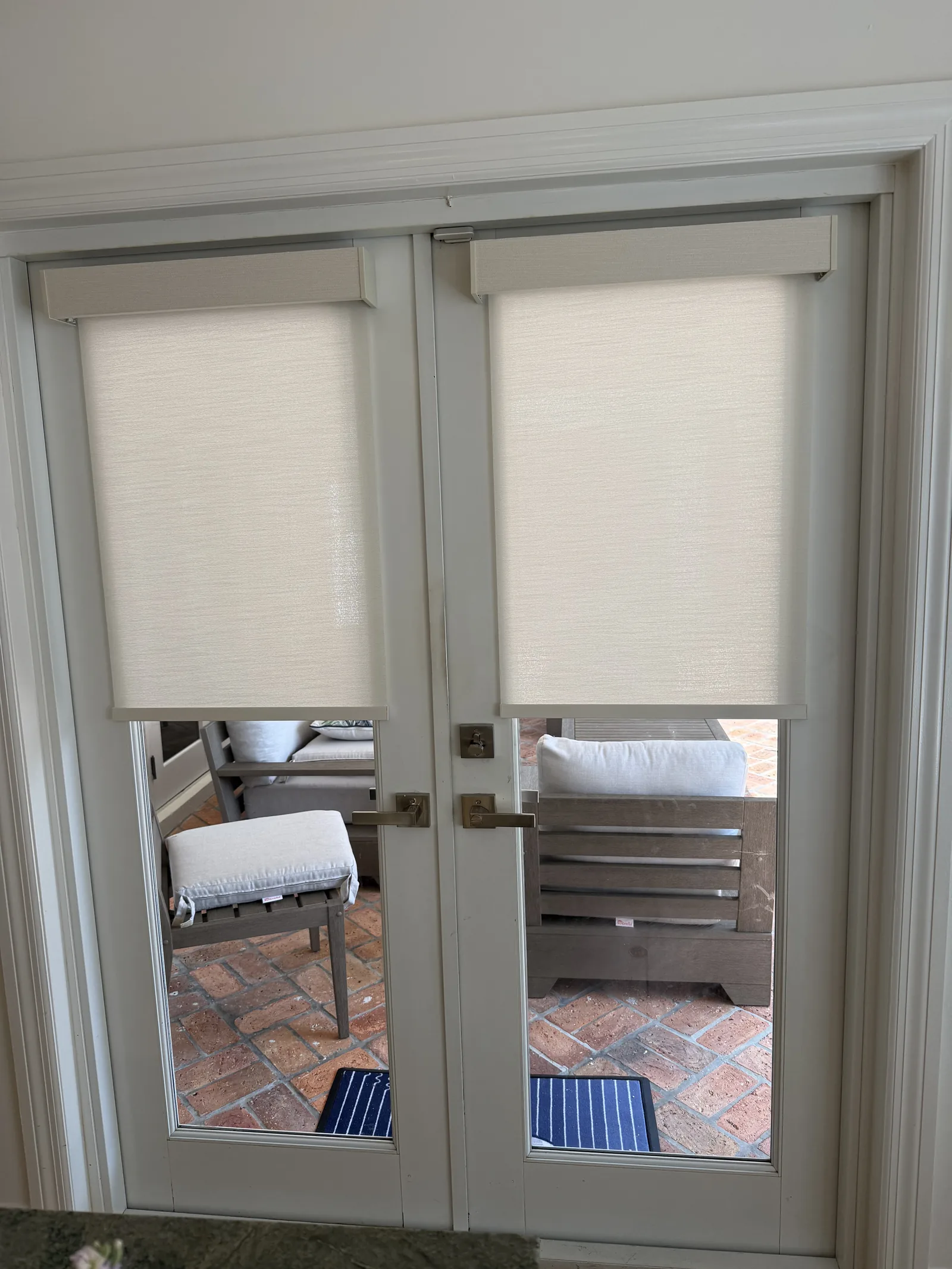 Light-filtering roller shades fitted to each French door panel