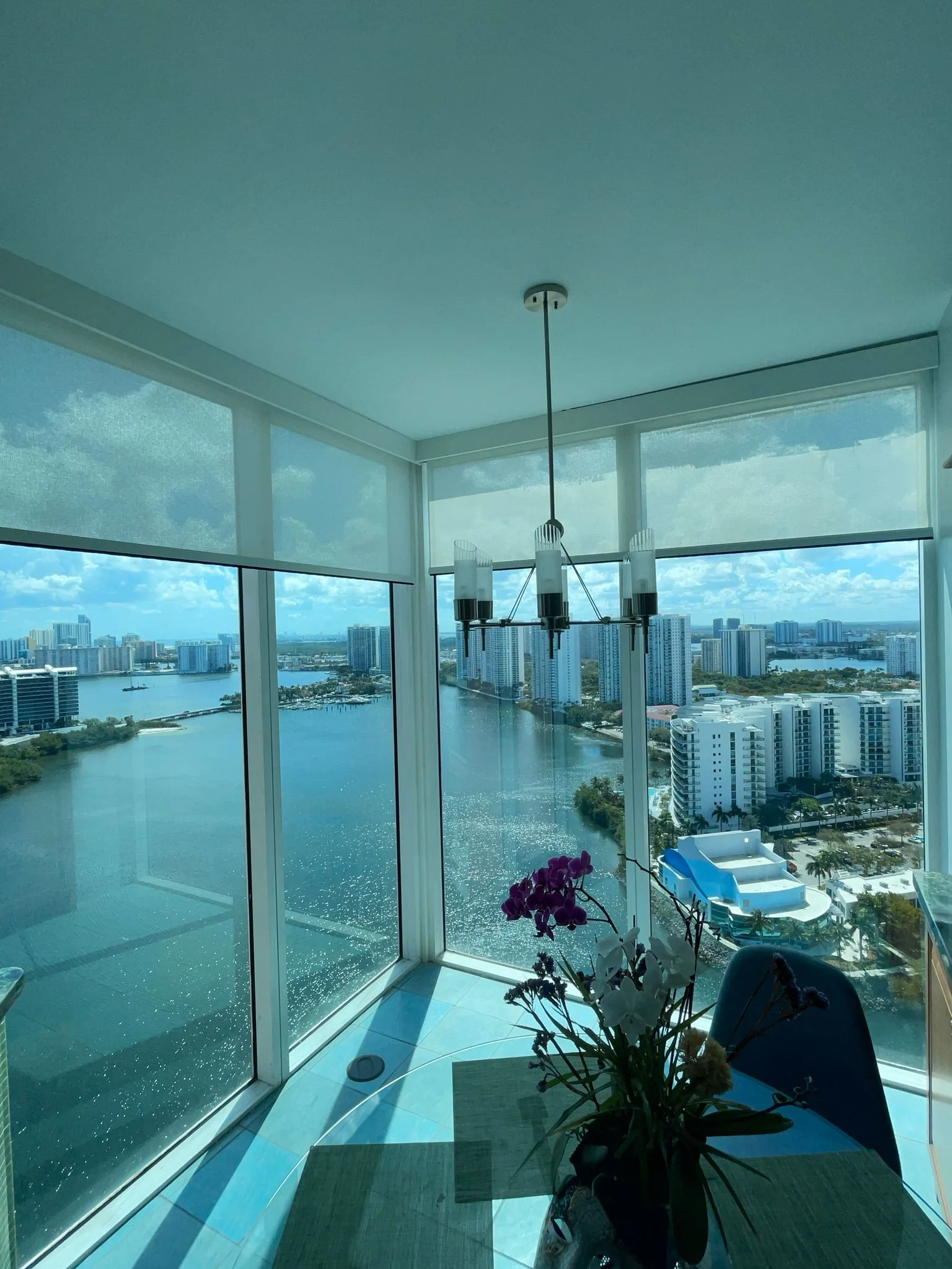 Roller screen shades keeping the water view while cutting glare