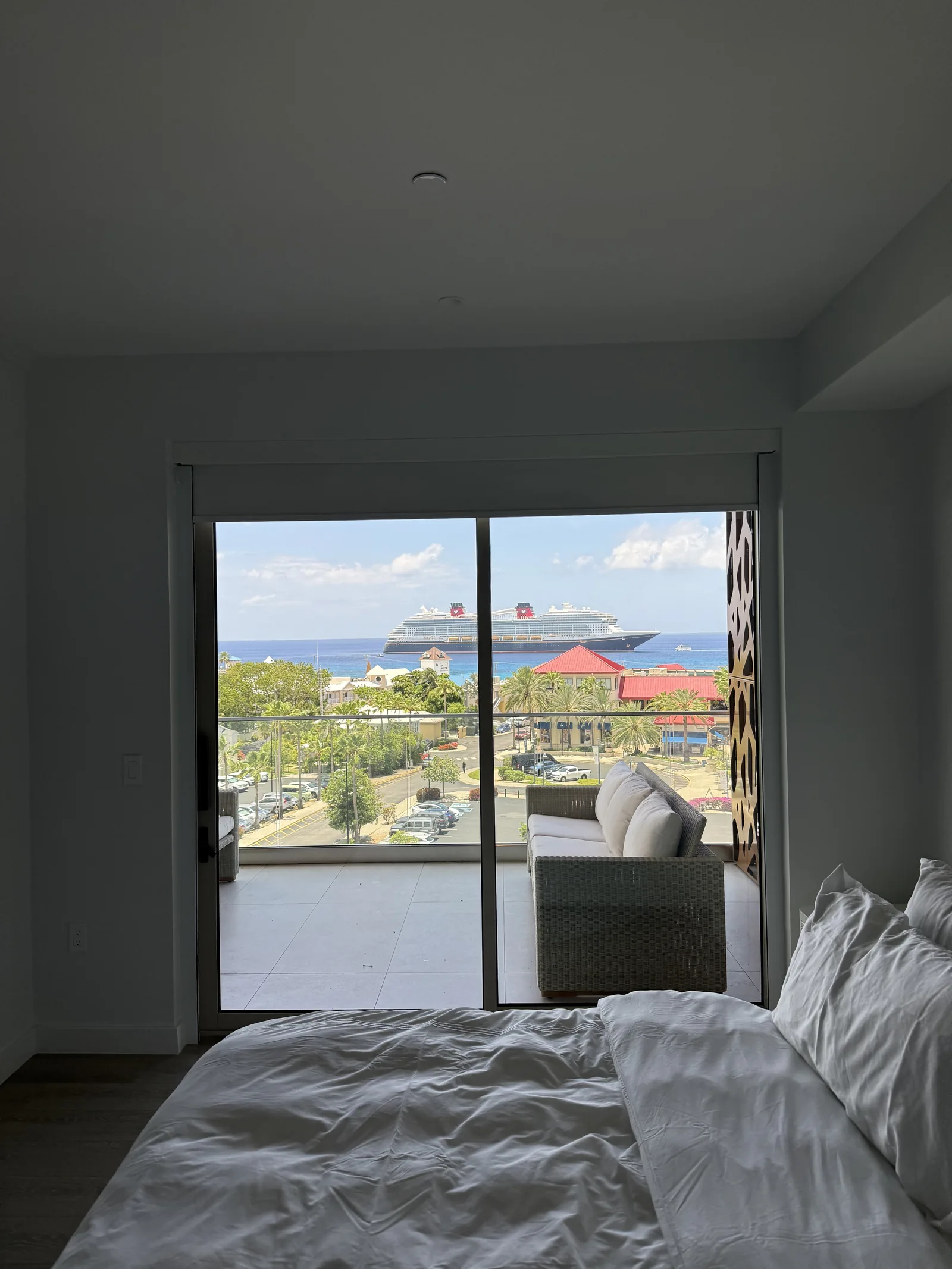 Blackout shade with side channels in a bedroom with an ocean view