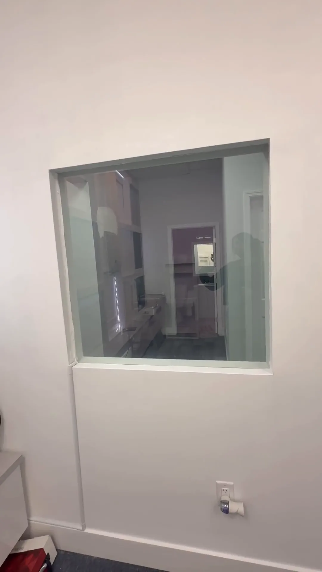 Smart film switched to clear, showing straight through the glass into the next room