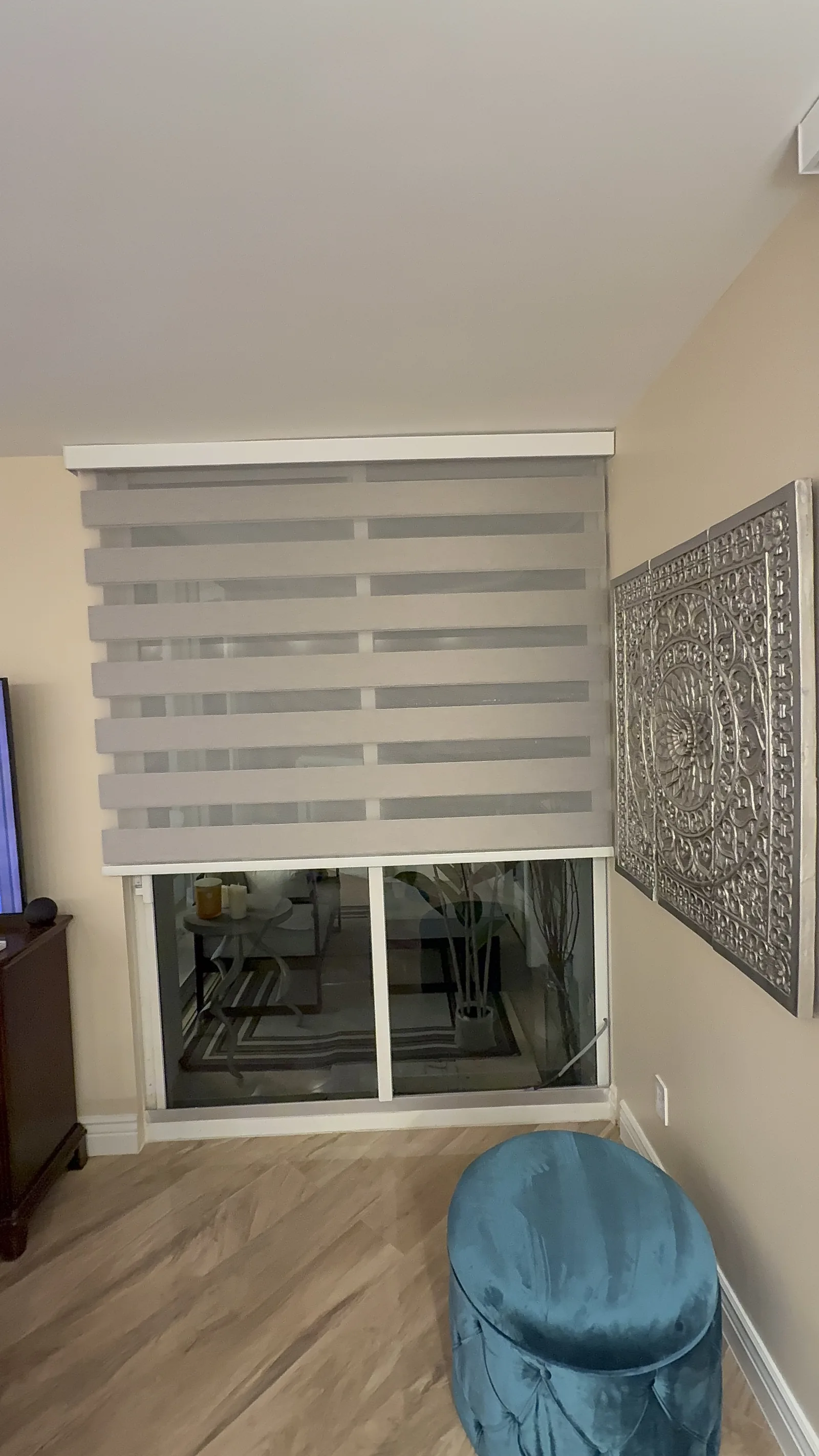 Zebra dimout shade in a bedroom corner
