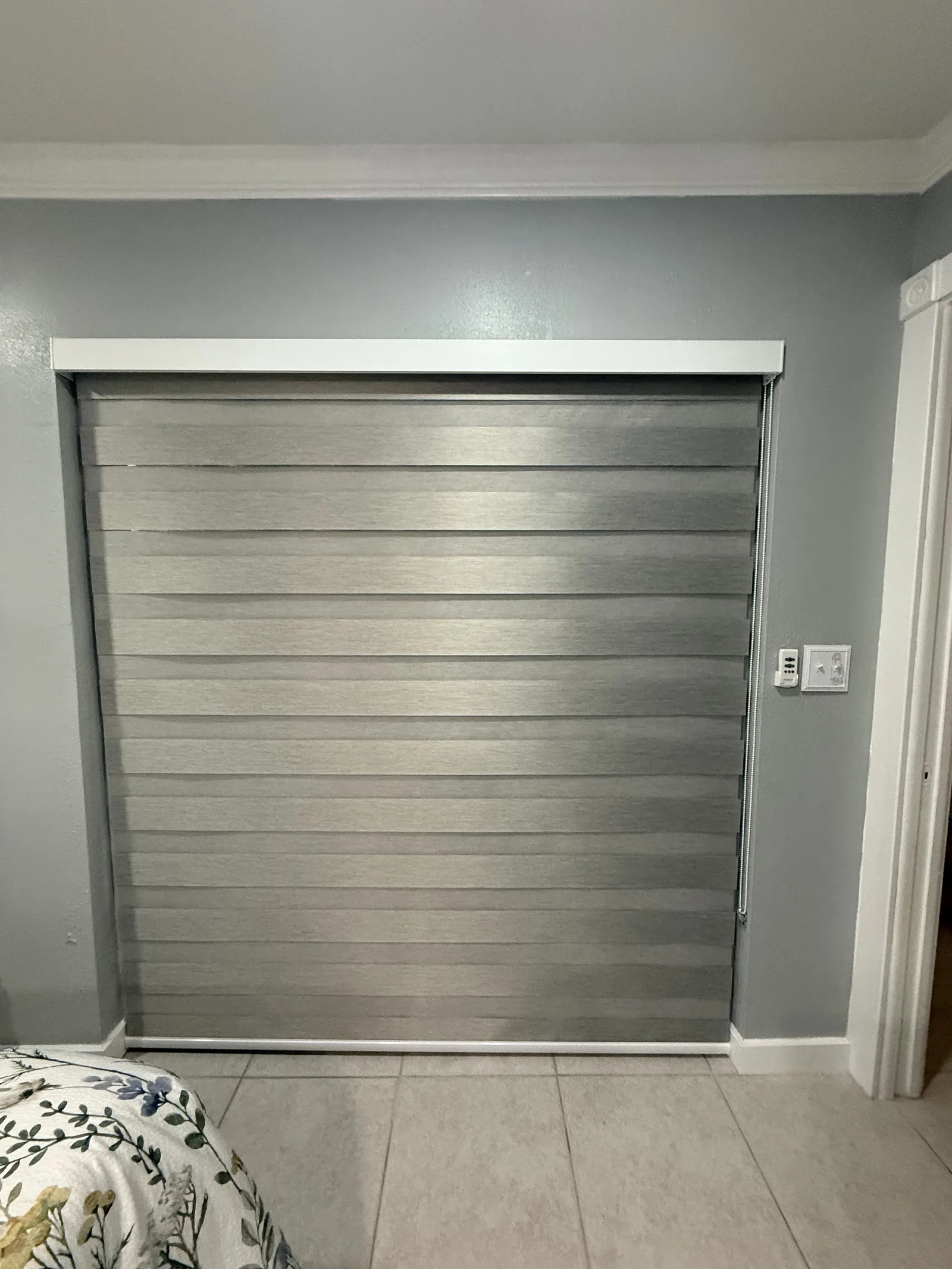 Zebra dimout shade installed on a closet door
