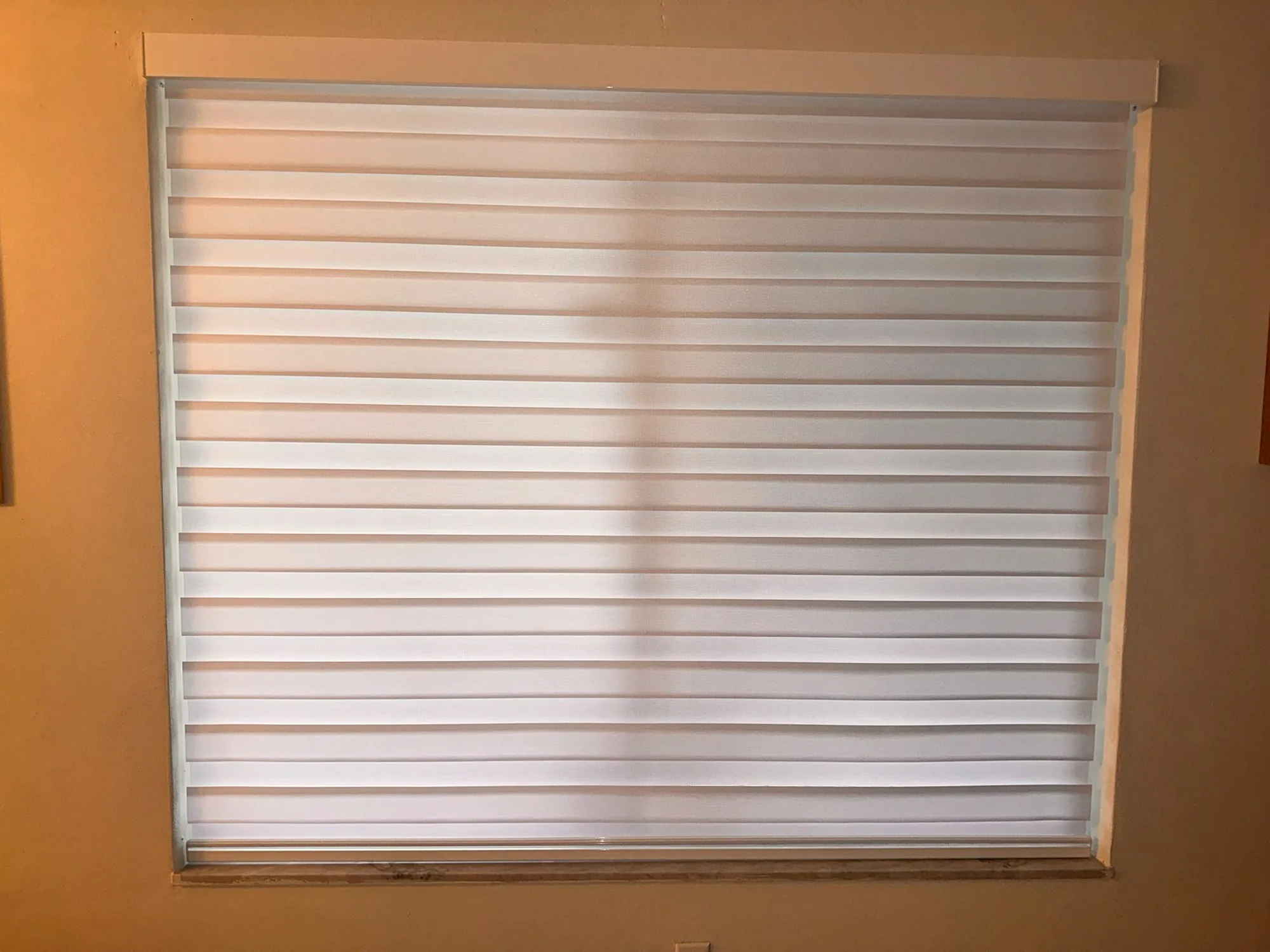 Zebra light-filtering shades in a bright kitchen