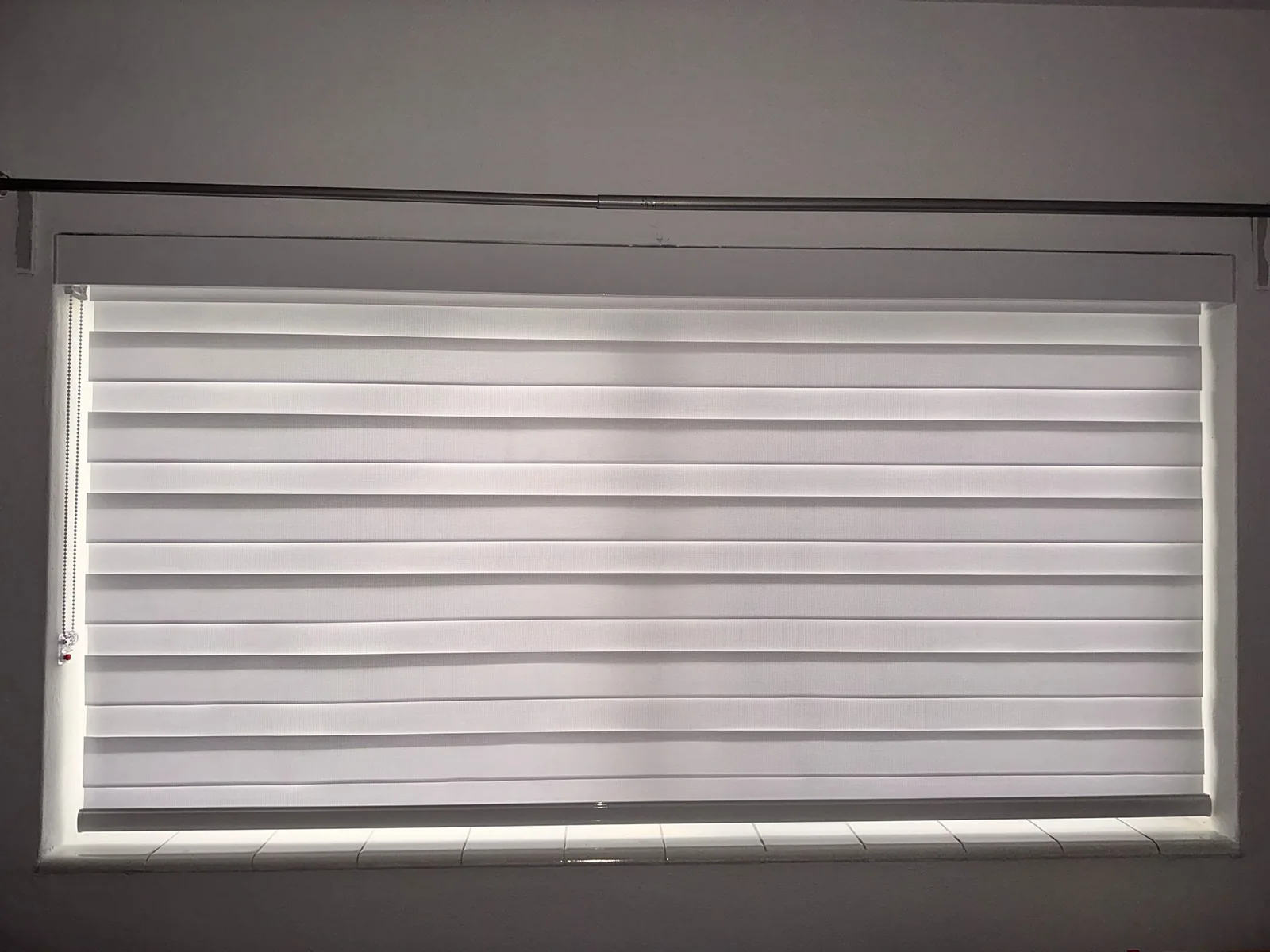 Zebra light-filtering shade in a bright room
